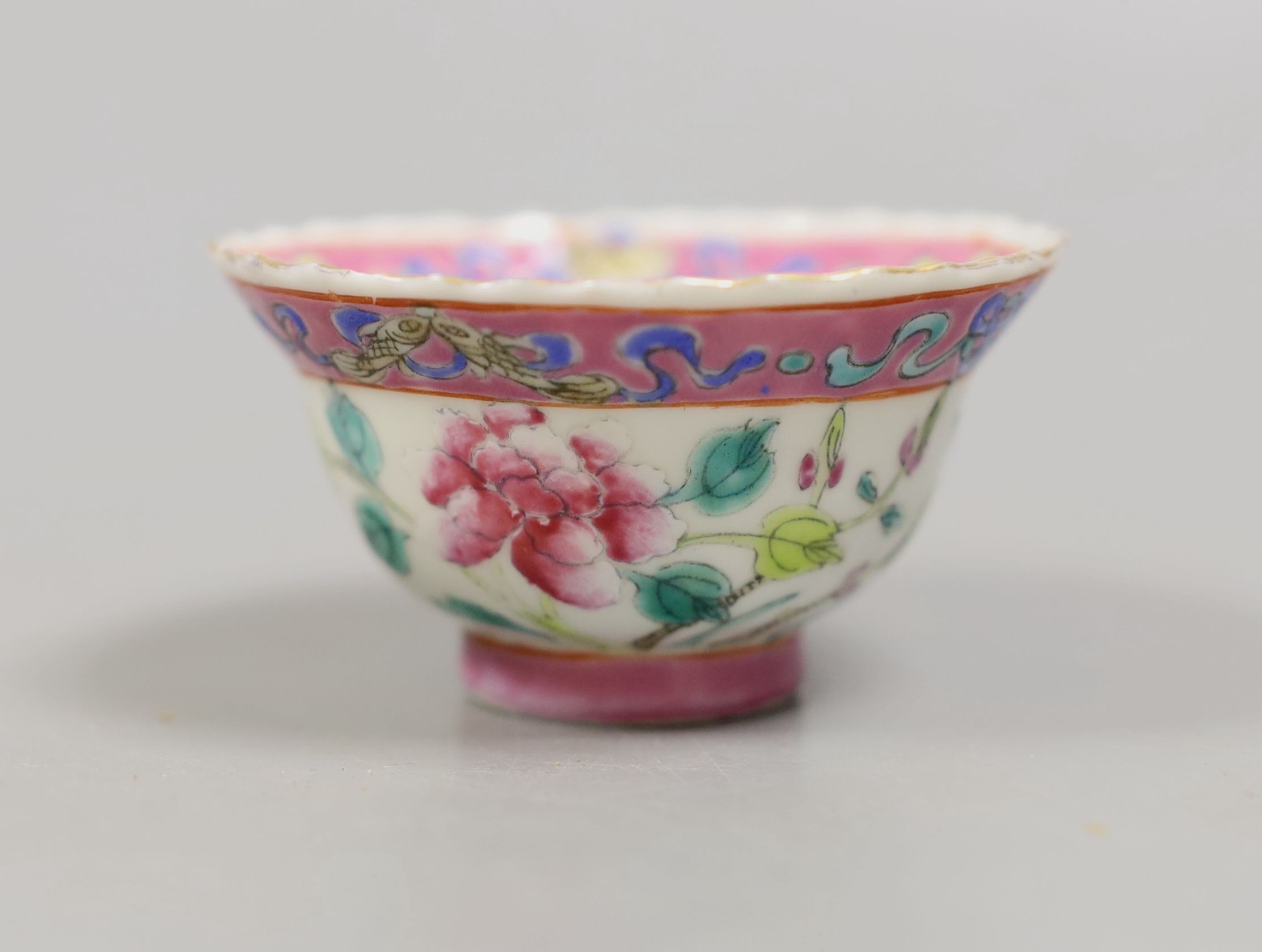 A Chinese Straits famille rose tea bowl, 7 cms diameter.